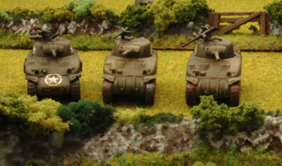 Three Shermans from the 3rd Platoom make it to the next field